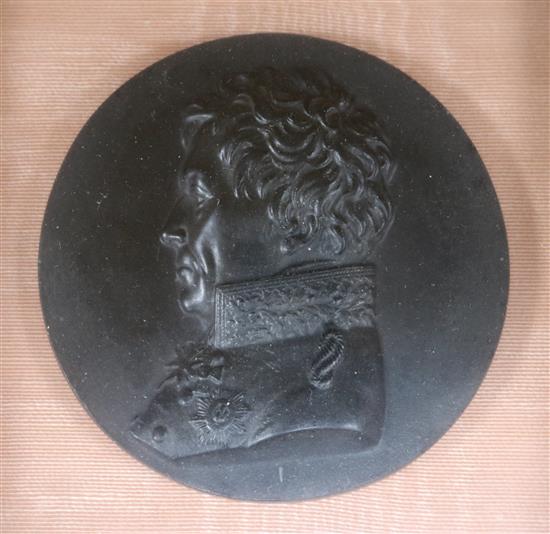 A framed pair of parian plaques and a basalt plaque of Wellington
